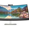 Front view of HP E34m G4 34" WQHD Curved USB-C Conferencing Monitor in black. Side profile showcasing the slim design of the HP E34m G4 monitor. Back panel displaying HDMI, DisplayPort, USB-C, USB-A, and Ethernet ports on the HP E34m G4 monitor. HP E34m G4 monitor on a desk setup with dual-screen configuration. Close-up of the ergonomic stand with tilt, swivel, and height adjustments on the HP E34m G4 monitor. HP E34m G4 monitor displaying vibrant visuals with 99% sRGB color gamut.