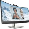 Front view of HP E34m G4 34" WQHD Curved USB-C Conferencing Monitor in black. Side profile showcasing the slim design of the HP E34m G4 monitor. Back panel displaying HDMI, DisplayPort, USB-C, USB-A, and Ethernet ports on the HP E34m G4 monitor. HP E34m G4 monitor on a desk setup with dual-screen configuration. Close-up of the ergonomic stand with tilt, swivel, and height adjustments on the HP E34m G4 monitor. HP E34m G4 monitor displaying vibrant visuals with 99% sRGB color gamut.