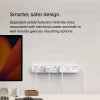 Belkin SRB001AR2M Surge Plus 3Outlet Surge Protector with 2 USB Ports with devices plugged into the outlets