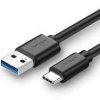 UGREEN USB-A 3.0 to USB-C cable unboxed Close-up of nickel-plated connectors UGREEN cable charging Android smartphone Data transfer between SSD and laptop via UGREEN cable 2M cable in coiled layout on work desk UGREEN US287 packaging and model label