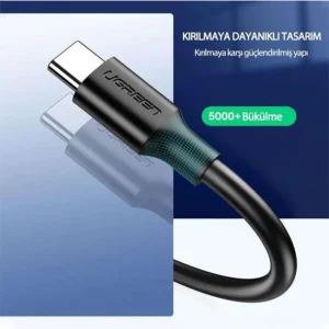 UGREEN USB-A 3.0 to USB-C cable unboxed Close-up of nickel-plated connectors UGREEN cable charging Android smartphone Data transfer between SSD and laptop via UGREEN cable 2M cable in coiled layout on work desk UGREEN US287 packaging and model label