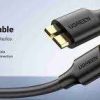 UGREEN USB-A to Micro USB 3.0 cable full view Close-up of Micro USB 3.0 male connector UGREEN cable connected to portable hard drive Cable in use with Samsung external SSD 1-meter cable length on desk setup Product packaging of UGREEN US130