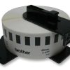 Brother DK-22210 continuous paper label roll front view Brother DK-22210 showing white roll with black print Brother DK-22210 roll installed in a Brother QL printer Brother DK-22210 printing custom-length labels Brother DK-22210 close-up on printed label surface Brother DK-22210 roll alongside packaging box